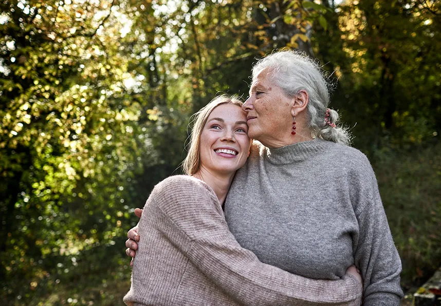 Adult daughter hugging mother